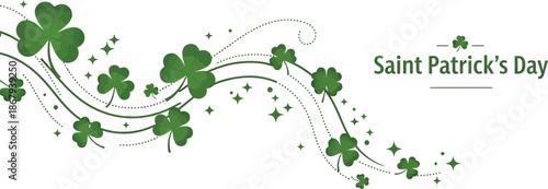 A festive Saint Patrick's Day decorative banner featuring a flowing design of green shamrocks and sparkling elements on a clean white background.