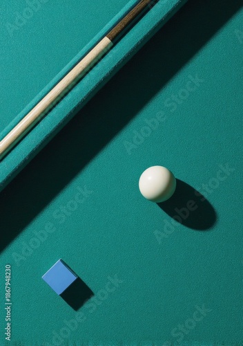 Billiard Cue, Cue Ball, and Chalk on Green Table Felt