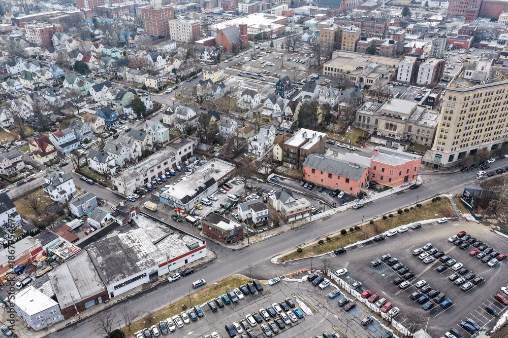 Fototapeta premium Foggy aerial drone photo of Mount Vernon New York with overcast winter sky and dense neighborhoods, image 28