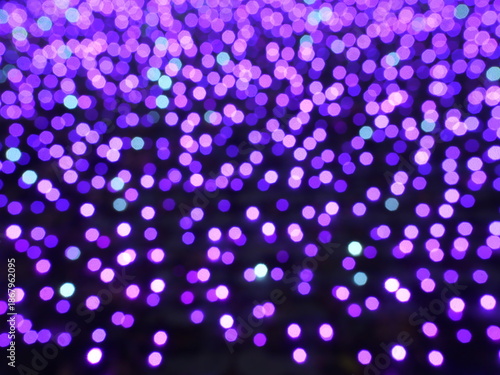 Abstract Bokeh from indoor lighting, Pink with blue with red with white and purple circles, Night city light background for celebration of christmas and holiday season