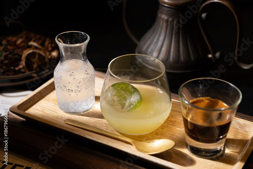 фотографія Refreshing specialty coffee set featuring a sparkling citrus base with an ice ball, espresso, and soda water