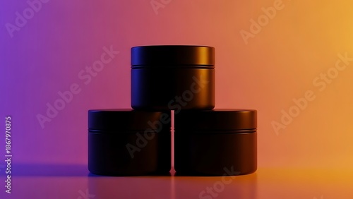 Three black cylindrical containers stacked on each other with colorful background