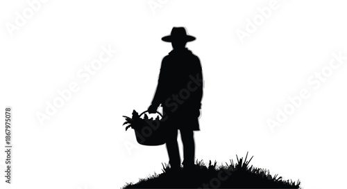 Farmer silhouette in hat carrying basket of fresh produce at sunrise