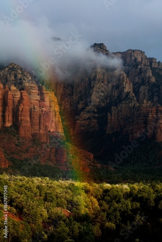 A vivid rainbow in the red rocks of Sedona, Arizona.