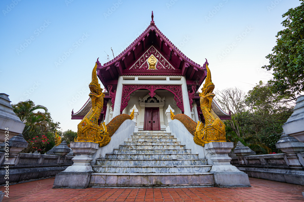 Fototapeta premium Traditional Thai ordination hall with Naga serpents at Wat Santikhiri at dusk in Mae Salong, Chiang Rai Province, Northern Thailand