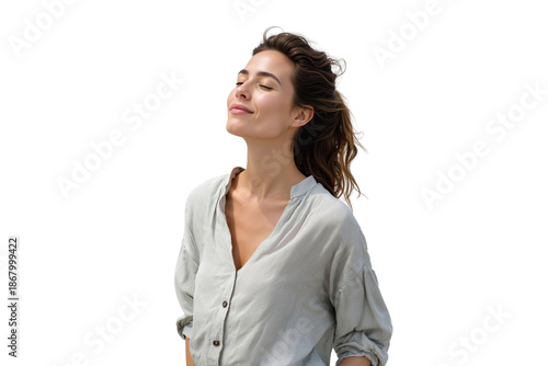 Serene young woman with eyes closed, smiling and feeling the breeze with wind in her hair, isolated on transparent background