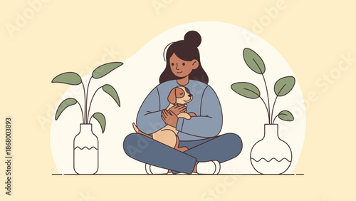 Young woman holding a small puppy in her arms.