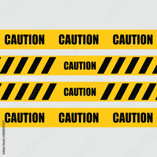 Yellow caution tape with black warning signs and diagonal stripes