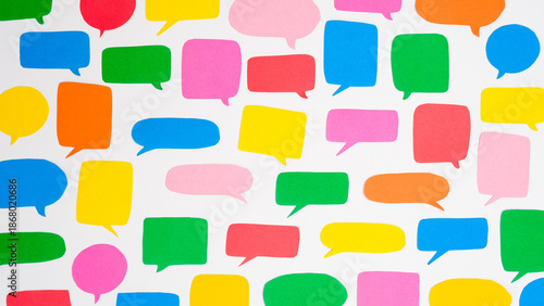 Pattern of multi-colored speech bubbles on a white background. Communication and social connections concept