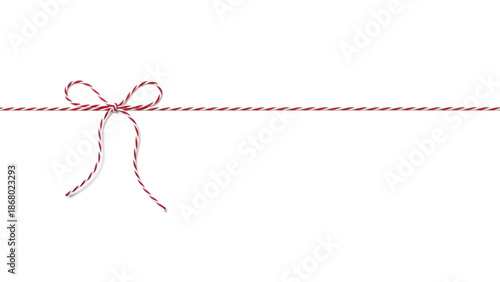 Elegant red and white baker's twine bow with string extending horizontally on white