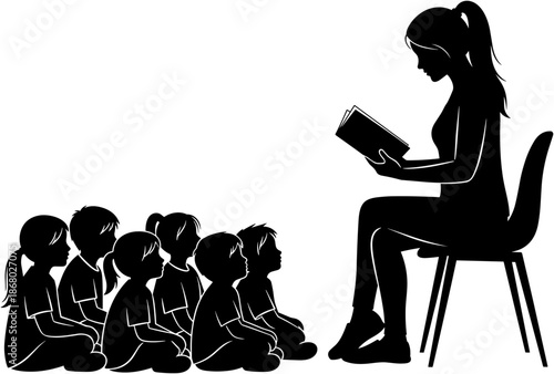 Black and white silhouette of a female teacher sitting and reading a book to a group of attentive young children