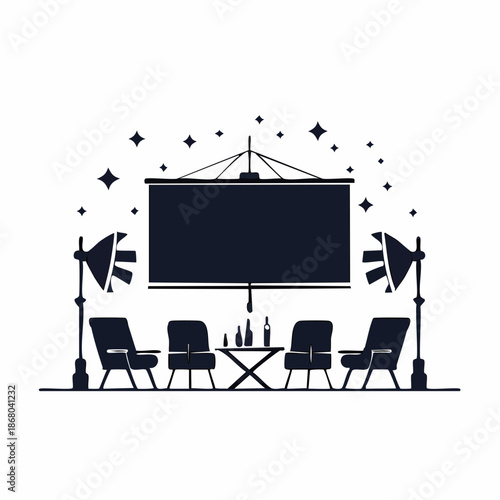 A film director's setup on a film set with equipment and chairs on a stage