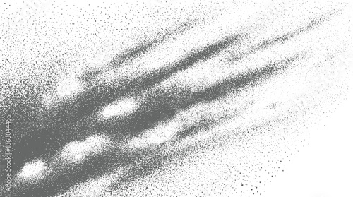 Abstract background of scattered grey dots and fine particles forming streaks and gradients with a sense of motion and depth