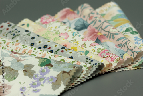 Colorful cotton fabric scraps. Close-up of natural fabric pieces. Sewing textiles are layered.