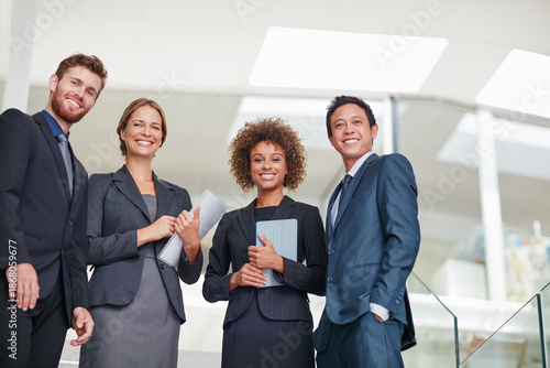 Obraz na plátně Smile, portrait or legal team on stairs in office with paperwork, professional or confident for career