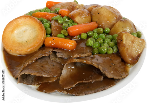 Φωτογραφία Roast beef with roasted vegetables and gravy on a plate