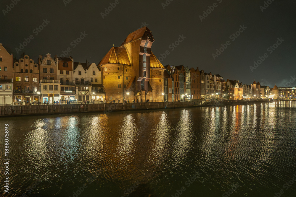 Naklejka premium Gdansk and the Motlawa River at night, Poland.