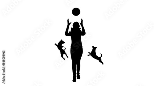 A woman plays with her dogs in a fun outdoor setting