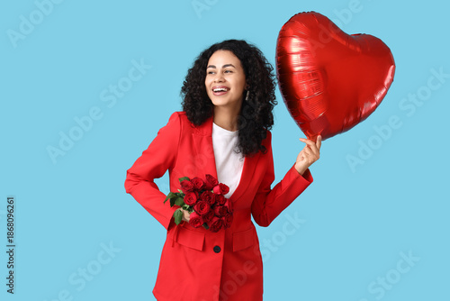 Smiling young woman in red ...