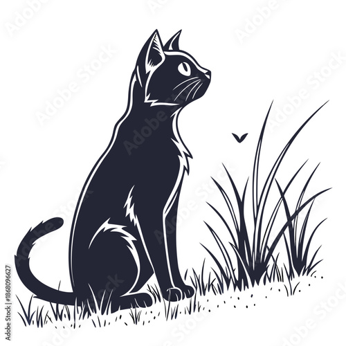 Cat sitting in grass