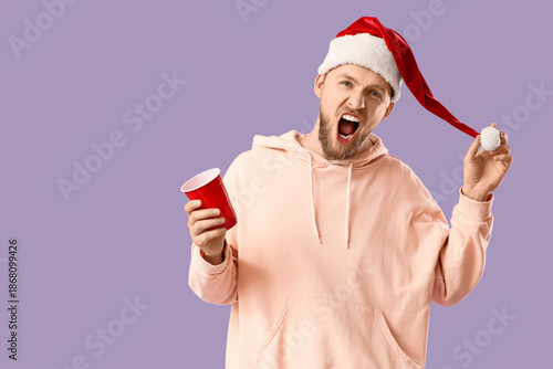 Drunk young man in Santa ha...