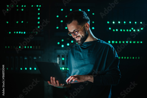 It engineer working on server in data center