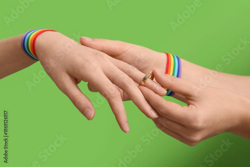 Female hands with rainbow r...