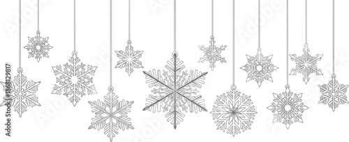 Collection of hanging snowflake ornaments with intricate winter cold