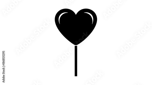 A lollipop in the shape of a heart, in silhouette