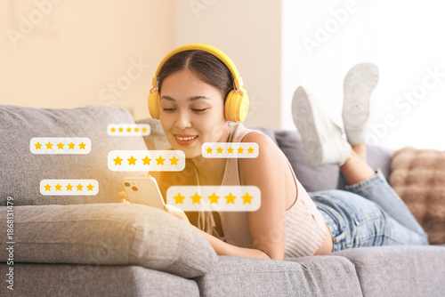 Asian woman in headphones g...