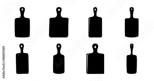 Eight different black and white cutting board silhouette shapes on white backdrop