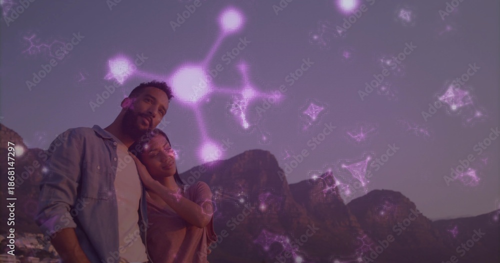 Fototapeta premium Standing pair leaning on shoulder looking over peaks at dusk denim-shirt purple-overlay, copy space