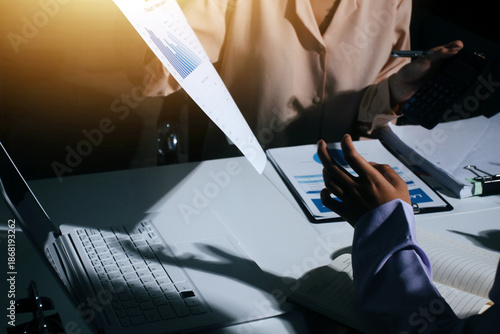 Above table with finance papers, graphs and big data during teamwork meeting with accounting or marketing team discussing budget, strategy or growth development. Closeup of SEO team doing research