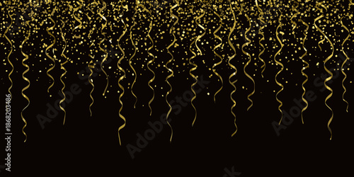 A cascade of golden confetti and shimmering ribbons against a black backdrop
