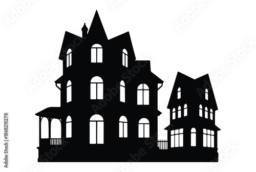 A silhouetted haunted house with multiple windows and a spooky facade
