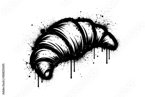 Grunge style croissant with ink splatter effect on white background