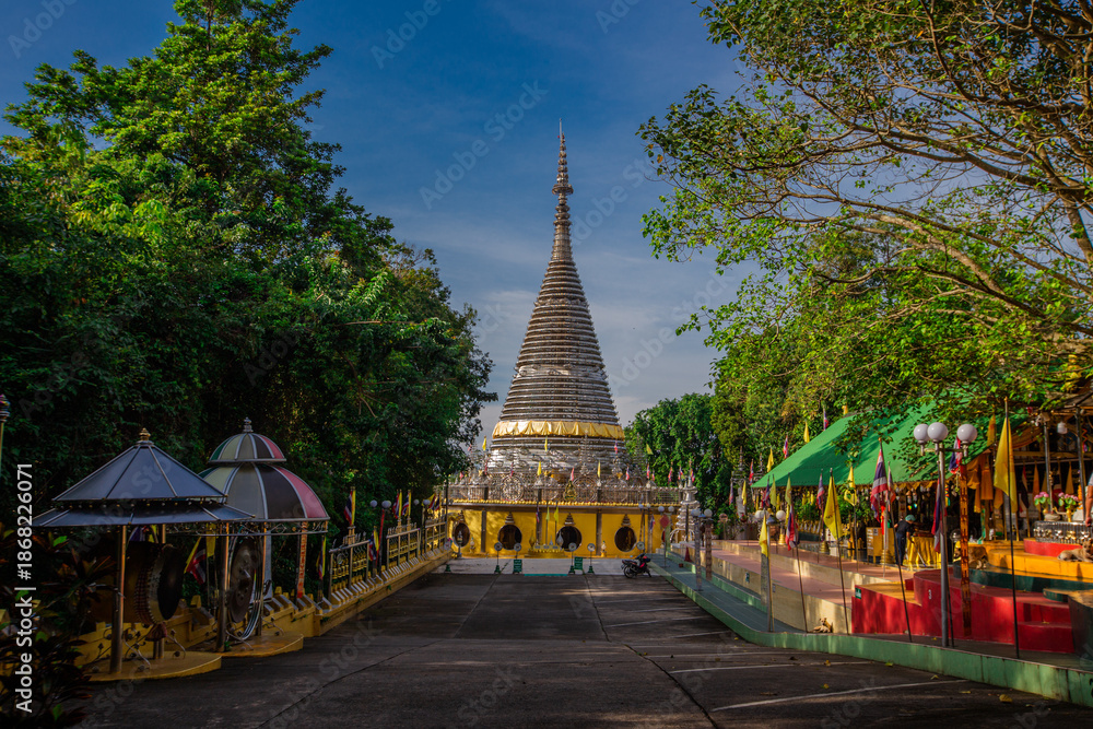 Fototapeta premium Background of religious sights on high mountains in Hat Yai District of Thailand (Phra Maha Ruesee Chedi Tripob Trimongkol) is a beautiful stainless steel pagoda, tourists always come to make merit du