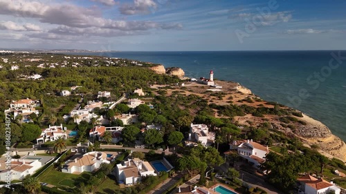 Aerial Drone Approach to Alfanzina Lighthouse on Sandstone Cliffs, Carvoeiro Algarve Portugal