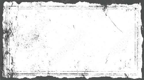 Distressed grunge rectangular frame with rough torn edges and subtle speckles creating a vintage textured background for