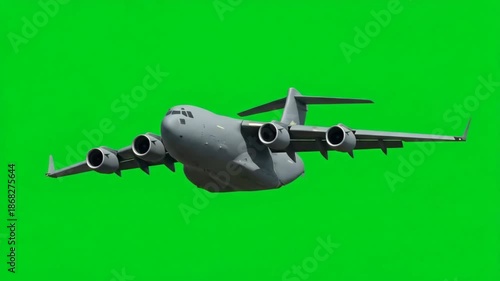 A powerful grey military transport plane soaring through the sky with a vibrant green background, ready for aerial operations