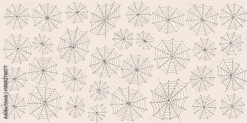 A dense pattern of detailed spiderwebs covering a light beige background