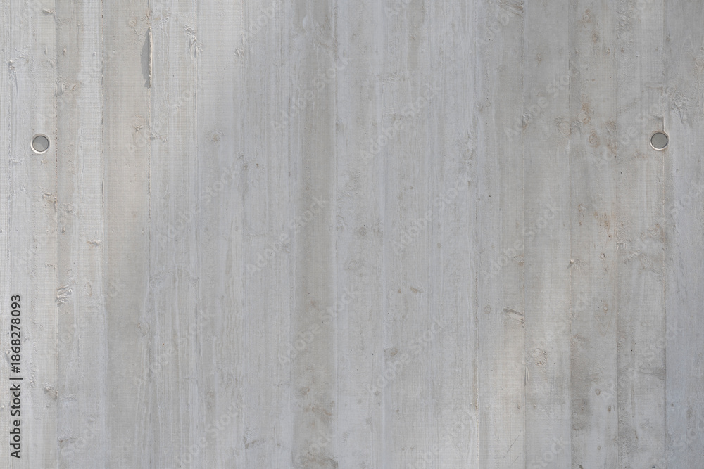 Obraz premium Sichtbeton Wandstruktur mit Sonneneinstrahlung – Graue Betonoberfläche, Minimalistische Architektur, Industrielles Design