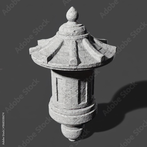 Stylish ancient Japanese stone lantern, crafted from granite with intricate layers, perfect for serene garden ambiance.