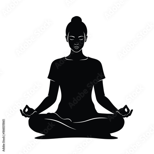 Silhouette of a woman meditating in a lotus pose