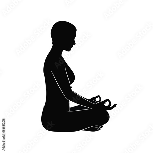 Woman in silhouette meditating in a seated pose