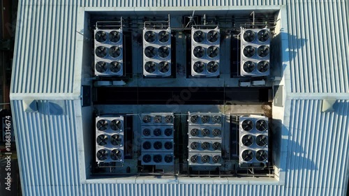 Aerial view of the Six Degrees data centre showcases the roof's array of cooling systems, gleaming under the sunlight, Redditch, United Kingdom.