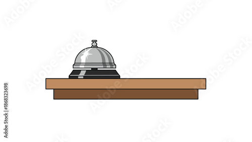 A silver reception bell sits on a simple wooden counter, ready to be rung for service, evoking a sense of traditional hospitality.