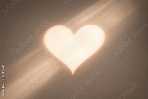 A heart of light and shadow on a flat surface. Love concept and Valentine's Day greetings for social media