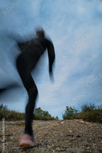 Motion Blur of a Person Running Outdoors