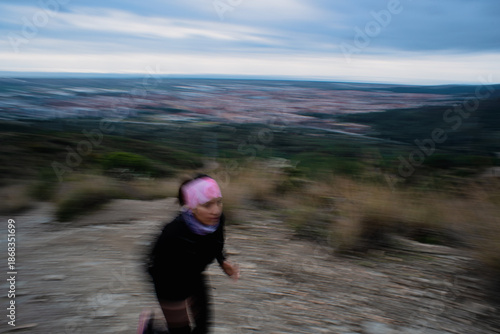 Woman Running on Mountain Trail Outdoors